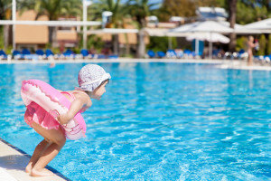 Little girl at the swimming pool