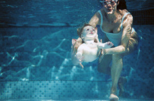 Mother and daughter in pool